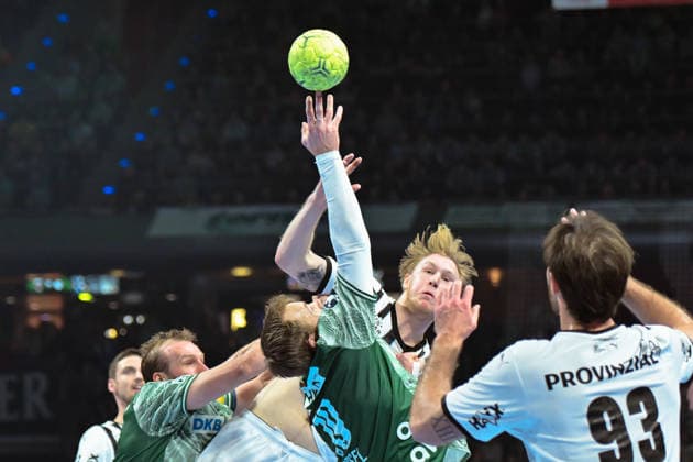 18 12 2025, xlakx, Handball DHB Pokal 1 4 Final, Fuechse Berlin THW Kiel v l Max Darj Fuechse Berlin , Eric Johansson THW Kiel , Mathias Gidsel Fuechse Berlin duel, duel, fight, tackle Berlin