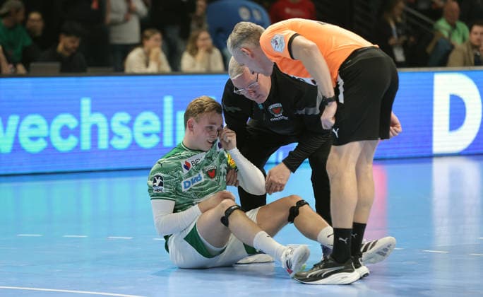 Tobias Schjoelberg Groendahl injured after duel Sport Handball DHB Cup quarter-finals mens season 2025 2026 18 12 2025 Füchse Berlin vs THW Kiel