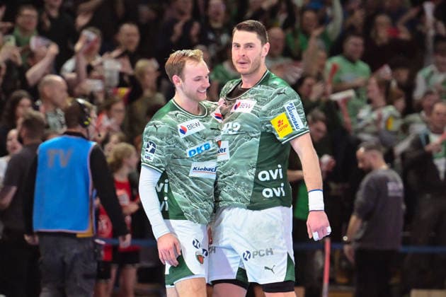 18.12.2025, xlakx, Handball DHB Pokal 1 4 Finale, Fuechse Berlin - THW Kiel v.l. Mathias Gidsel (Fuechse Berlin), Mijajlo Marsenic (Fuechse Berlin) Jubel ueber den Sieg Berlin