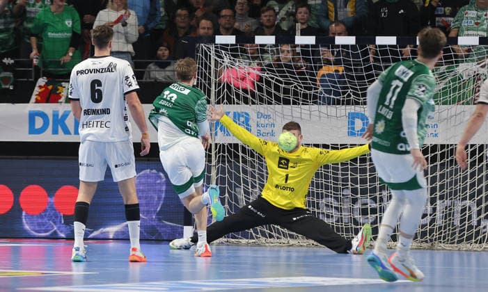 Mathias Gidsel scores a goal against goalkeeper Gonzalo Perez de Vargas duel Game scene Action Sport Handball DHB Cup quarter-finals mens season 2025 2026 18 12 2025 Füchse Berlin vs THW Kiel