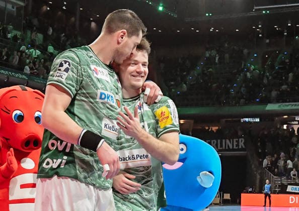 18 12 2025, xlakx, Handball DHB Pokal 1 4 Final, Fuechse Berlin THW Kiel v l Mijajlo Marsenic Fuechse Berlin , Hakun West Av Teigum Fuechse Berlin Celebrating the victory Berlin