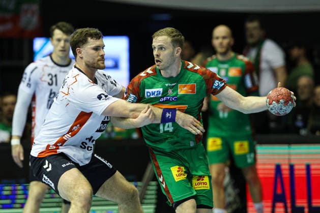 Omar Ingi Magnusson SC Magdeburg,14 vs Johannes Golla SG Flensburg Handewitt,4 Quarterfinals Handball DHB Cup Season 2025 2026 SC Magdeburg vs SG Flensburg Handewitt at the GETEC Arena in Magdeburg Action,Handball,Germany,18 12 2025