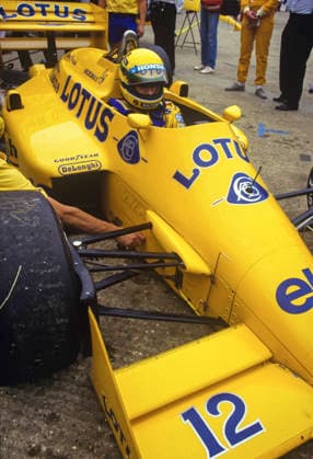 F1 Driver photoshoot 1987 Ayrton Senna In action in the pits in his yellow helmet and Lotus car showing slick rubber tyres with track dirt At the British Grand Prix 1987 FIA, Formula, One, World, Championship, Series, Grand, Prix, GP, GPs, world, dedicated, circuits, street, tracks, 1, F1 Copyright: xMarkxNewcombex