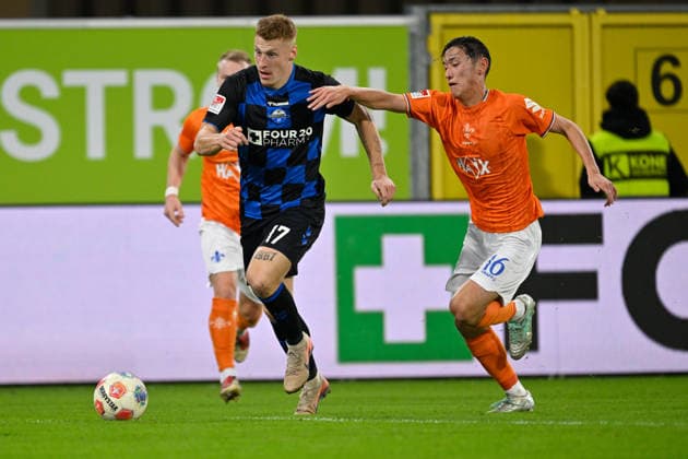 Paderborn, Home Deluxe Arena, 19 12 25, GER, Men, 2 Bundesliga, Season 2025 2026, SC Paderborn 07 SV Darmstadt 98 Picture from left in duel Laurin CURDA Paderborn and Hiroki AKIYAMA Darmstadt DFL regulations prohibit any use of photographs as image sequences and or quasi video NRW Germany