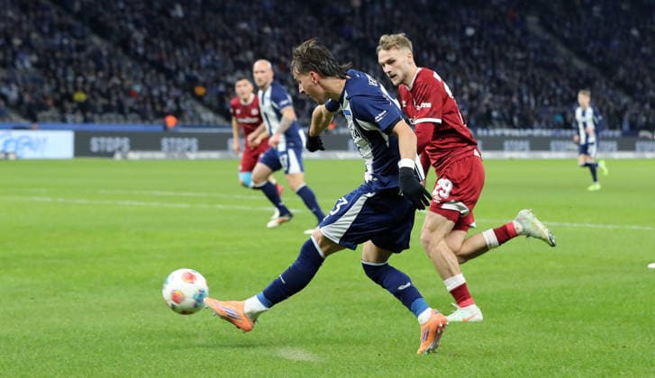 Michal Karbownik on the ball, Tim Handwerker duel Match scene Action Sport Football Soccer DFL 2 Bundesliga Men 17 Matchday Season 2025 2026 19 12 2025 Hertha BSC Berlin vs DSC Arminia Bielefeld DFL regulations prohibit any use of photographs as image sequences and or quasi video