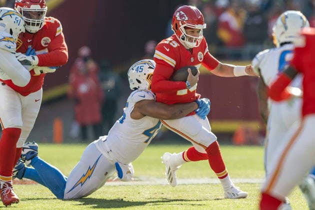 December 19, 2025: Kansas City Chiefs quarterback Patrick Mahomes (15) is sacked by Los Angeles Chargers linebacker Tuli Tuipulotu (45) during the first quarter at GEHA Field at Arrowhead Stadium on Dec. 14, 2025, in Kansas City, Missouri. - ZUMAm67_ 20251219_zaf_m67_004 Copyright: xEmilyxCurielx