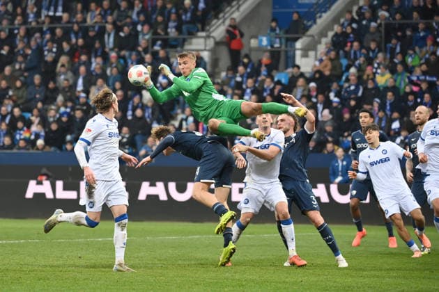 Goalkeeper Hans Christian Bernat Karlsruher SC saves against Mats Pannewig VfL Bochum , right Philipp Strompf VfL Bochum 20 12 2025, Soccer 2 Bundesliga, Season 2025 2026, 17 Matchday, VfL Bochum Karlsruher SC DFL regulations prohibit any use of photographs as image sequences and or quasi video Bochum Vonovia Ruhrstadion Nordrhein Westfalen Germany Team2