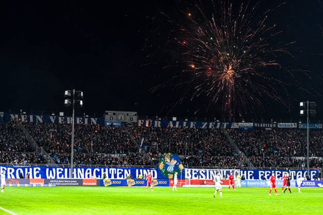 The fans of TSV 1860 Muenchen have lit sparklers in the Westkurve, a banner with Christmas wishes is hung up and rockets are fired, 20 12 2025, Munich Germany , Football, 3 Liga, TSV 1860 München SC Verl, DFB DFL REGULATIONS PROHIBIT ANY USE OF PHOTOGRAPHS AS IMAGE SEQUENCES AND OR QUASI VIDEO xslx