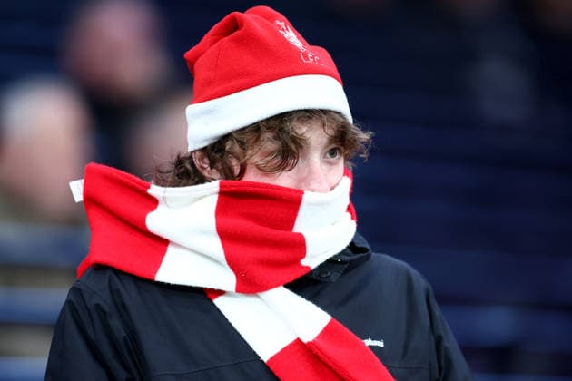London, England, 20th December 2025. Liverpool fan with a Christmas hat on during the Tottenham Hotspur vs Liverpool Premier League match at the Tottenham Hotspur Stadium, London. Picture credit should read: Paul Terry Sportimage EDITORIAL USE ONLY. No use with unauthorised audio, video, data, fixture lists, club league logos or live services. Online in-match use limited to 120 images, no video emulation. No use in betting, games or single club league player publications. SPI_005_PT_Tottenham_Liverpool SPI-4387-0005