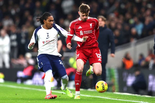 London, England, 20th December 2025. Djed Spence of Tottenham Hotspur and Conor Bradley of Liverpool challenge for the ball during the Tottenham Hotspur vs Liverpool Premier League match at the Tottenham Hotspur Stadium, London. Picture credit should read: Paul Terry Sportimage EDITORIAL USE ONLY. No use with unauthorised audio, video, data, fixture lists, club league logos or live services. Online in-match use limited to 120 images, no video emulation. No use in betting, games or single club league player publications. SPI_018_PT_Tottenham_Liverpool SPI-4387-0018