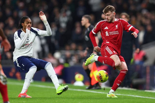 London, England, 20th December 2025. Djed Spence of Tottenham Hotspur and Conor Bradley of Liverpool challenge for the ball during the Tottenham Hotspur vs Liverpool Premier League match at the Tottenham Hotspur Stadium, London. Picture credit should read: Paul Terry Sportimage EDITORIAL USE ONLY. No use with unauthorised audio, video, data, fixture lists, club league logos or live services. Online in-match use limited to 120 images, no video emulation. No use in betting, games or single club league player publications. SPI_020_PT_Tottenham_Liverpool SPI-4387-0020
