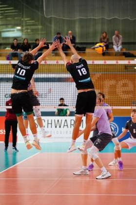 Patrick Rupprecht 10 TSV Haching Munich and Iven Fietje Ferch 18 TSV Haching Munich block at the net while Joris Backhaus 5 VCO Berlin is on standby Block at the net with Joris Backhaus 5 VCO Berlin on standby Copyright: xspeedshotx