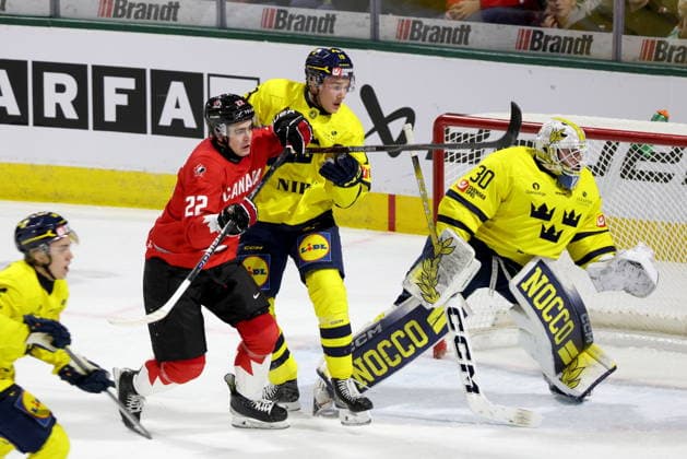 December 20, 2025, London, On, Canada: Canada forward Porter Martone (22) battles Sweden defenceman William Hakansson (19) in front of goaltender Love Harenstam (30) during the first period of a IIHF World Junior Hockey Championship pre-tournament game in London, Ont., Saturday, December 20, 2025. Canada News - December 20, 2025  - ZUMAc35_ 20251220_zaf_c35_060 Copyright: xNicolexOsbornex