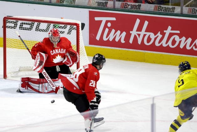 December 20, 2025, London, On, Canada: Canada goaltender Jack Ivankovic (1) makes a save on Sweden defenceman Sascha Boumedienne (5) during the second period of a IIHF World Junior Hockey Championship pre-tournament game in London, Ont., Saturday, December 20, 2025. Canada News - December 20, 2025  - ZUMAc35_ 20251220_zaf_c35_072 Copyright: xNicolexOsbornex