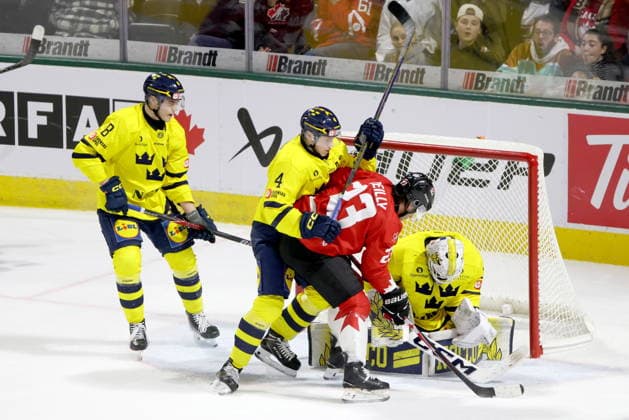December 20, 2025, London, On, Canada: Canada forward Sam O Reilly (23) looks for a loose puck against Sweden defenceman Leo Sahlin Wallenius (4) and goaltender Love Harenstam (30) during the third period of a IIHF World Junior Hockey Championship pre-tournament game in London, Ont., Saturday, December 20, 2025. Canada News - December 20, 2025  - ZUMAc35_ 20251220_zaf_c35_084 Copyright: xNicolexOsbornex