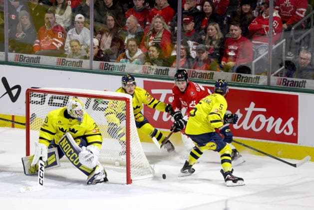 December 20, 2025, London, On, Canada: Sweden defenceman Alfons Freij (20) and Sascha Boumedienne (5) defend against Canada forward Caleb Desnoyers (25) behind Sweden goaltender Love Harenstam (30) during the third period of a IIHF World Junior Hockey Championship pre-tournament game in London, Ont., Saturday, December 20, 2025. Canada News - December 20, 2025  - ZUMAc35_ 20251220_zaf_c35_087 Copyright: xNicolexOsbornex