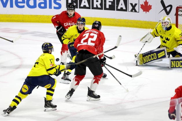 December 20, 2025, London, On, Canada: Sweden defenceman Sascha Boumedienne (5) watches teammate Valter Lindberg (17) play the puck against Canada forward Michael Misa (7) and Porter Martone (22) during the third period of a IIHF World Junior Hockey Championship pre-tournament game in London, Ont., Saturday, December 20, 2025. Canada News - December 20, 2025  - ZUMAc35_ 20251220_zaf_c35_090 Copyright: xNicolexOsbornex
