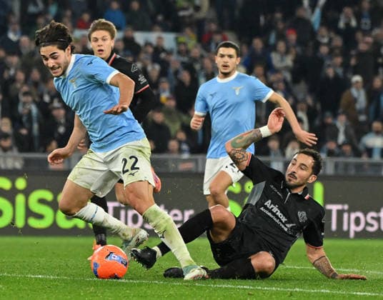 (251221) -- ROMA, Dec. 21, 2025 -- Lazio s Matteo Cancellieri (front L) vies with Cremonese s Federico Ceccherini (front R) during a Serie A football match between Lazio and Cremonese in Rome, Italy, Dec. 20, 2025. (Photo by Xinhua) (SP)ITALY-ROME-FOOTBALL-SERIE A-LAZIO VS CREMONESE AlbertoxLingria 