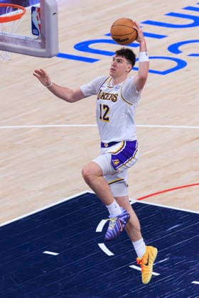 December 20, 2025, Inglewood, California, USA: Jake LaRavia 12 of the Los Angeles Lakers dunks the ball during their regular season NBA, Basketball Herren, USA game against the Los Angeles Clippers on Saturday December 20, 2025 at Intuit Dome in Inglewood, California. Clippers defeat Lakers, 103-88. ARIANA RUIZ PI Inglewood USA - ZUMAp124 20251220_zaa_p124_026 Copyright: xArianaxRuizx