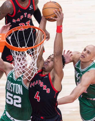 (251221) -- TORONTO, Dec. 21, 2025 -- Scottie Barnes (front C) of Toronto Raptors dunks during the 2025-2026 NBA, Basketball Herren, USA regular season game between Toronto Raptors and Boston Celtics in Toronto, Canada, on Dec. 20, 2025. ) (SP)CANADA-TORONTO-NBA-CELTICS VS RAPTORS ZouxZheng 