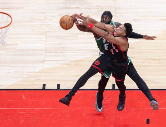 (251221) -- TORONTO, Dec. 21, 2025 -- Scottie Barnes (front) of Toronto Raptors fights for a rebound with Neemias Queta of Boston Celtics during the 2025-2026 NBA, Basketball Herren, USA regular season game between Toronto Raptors and Boston Celtics in Toronto, Canada, on Dec. 20, 2025. ) (SP)CANADA-TORONTO-NBA-CELTICS VS RAPTORS ZouxZheng 