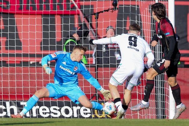 Goalkeeper Jan Reichert 1 FC Nuremberg and Benjamin Kaellmann Hannover 96 battle for the ball, 2 Bundesliga, 1 FC Nuremberg v Hannover 96, Max Morlock Stadion on December 21, 2025 in Nuremberg, Germany Photo by Marco Steinbrenner DeFodi Images Goalkeeper Jan Reichert 1 FC Nuremberg and Benjamin Kaellmann Hannover 96 battle for the ball, 2 Bundesliga, 1 FC Nuremberg v Hannover 96, Max Morlock Stadion, December 21, 2025 in Nuremberg, Germany Photo by Marco Steinbrenner DeFodi Images