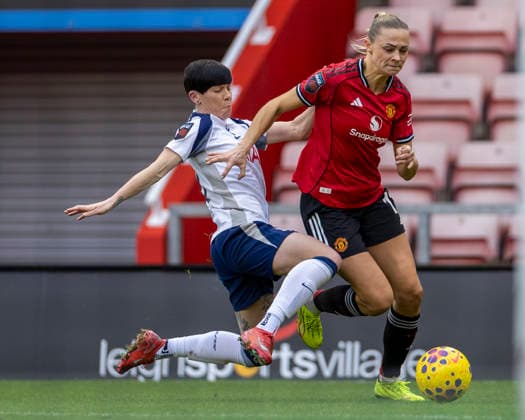 21st December 2025; Leigh Sports Village, Manchester, England; Womens League Cup Football Quarter Final, Manchester United, ManU versus Tottenham Hotspur; Fridolina Rolfo of Manchester United Women is tackled by Ashleigh Neville of Tottenham Hotspur Women  TimxWilliams