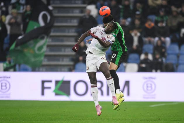 US Sassuolo v Torino FC - Serie A Duvan Zapata of Torino FC comeptes for the ball with Tarik Muharemovic of US Sassuolo during the Serie A football match between US Sassuolo and Torino FC. Reggio Emilia Italy Copyright: xNicolòxCampox