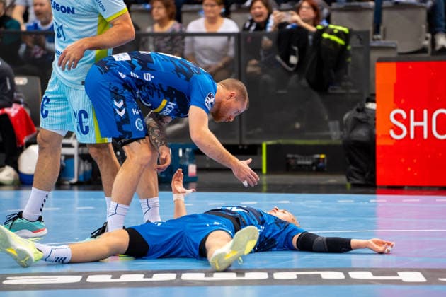 Handball I Men I Season 2025 2026 I Bundesliga I 18 Matchday I TVB Stuttgart VfL Gummersbach I 21 12 2025 Patrick Zieker 25, TVB Stuttgart and Torben Matzken 22, TVB Stuttgart on the ground Stuttgart Porsche Arena Baden Württemberg Germany Copyright: xLobeca MaxxPetershansx