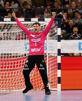 BAU 21 12 2025 Stuttgart Handball TVB Stuttgart vs VfL Gummersbach, Mateusz Kornecki TVB, right cheers and clenches his fists