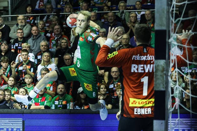 Matthias Musche SC Magdeburg,6 vs Goalkeeper Domenico Ebner SC DHfK Leipzig,1 Handball Bundesliga Season 2025 2026 SC Magdeburg vs SC DHFK Leipzig at the GETEC Arena in Magdeburg Action,Handball,Germany,21 12 2025