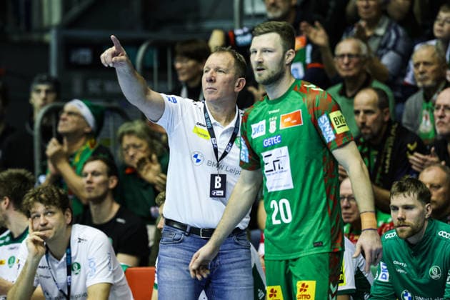 Coach Frank Carstens SC DHfK Leipzig and blurred Philipp Weber SC Magdeburg,20 Handball Bundesliga Season 2025 2026 SC Magdeburg vs SC DHFK Leipzig at the GETEC Arena in Magdeburg Handball,Germany,21 12 2025