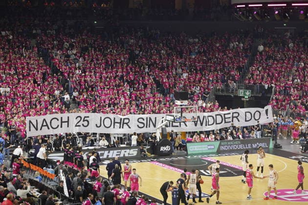 Fans with banners at the Telekom Baskets Bonn vs FC Bayern Munich basketball match Record game in front of over 19,000 spectators in the Lanxess Arena Kölnarena, Koelnarena 31 Speiltag Saison 2025 26