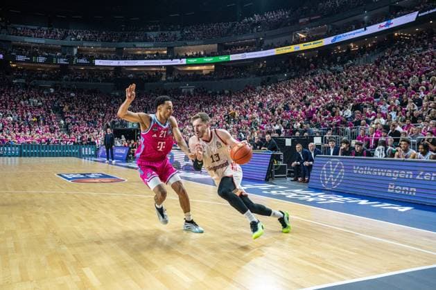 Game action with Joel Aminu 21 Telekom Baskets Bonn and Andreas Obst 13 FC Bayern Basketball Andreas Obst 13 FC Bayern Basketball with ball, Joel Aminu 21 Telekom Baskets Bonn and Alijah Comithier 2 Telekom Baskets Bonn defend Copyright: xFeyzullahxGökalpx