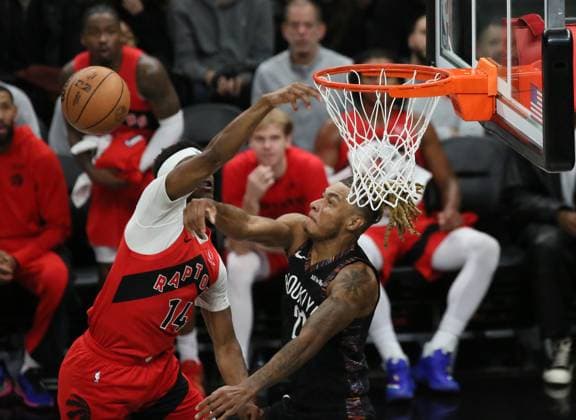 (251222) -- NEW YORK, Dec. 22, 2025 -- Ja Kobe Walter (L) of Toronto Raptors gets blocked by Noah Clowney of Brooklyn Nets during the 2025-2026 NBA, Basketball Herren, USA regular season game between Brooklyn Nets and Toronto Raptors in New York, the United States, Dec. 21, 2025. ) (SP)U.S.-NEW YORK-BASKETBALL-NBA-RAPTORS VS NETS ZhangxFengguo 