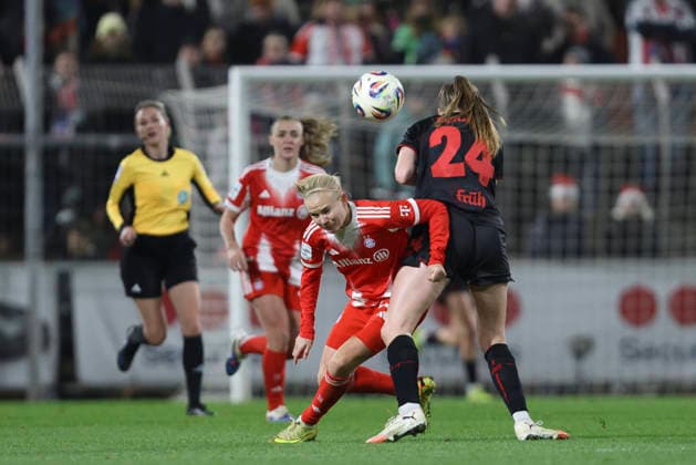 Pernille Harder FC Bayern München and Lilla Turanyi Bayer 04 Leverkusen battle for the ball during the Woman Bundesliga match between Bayer 04 Leverkusen and Bayern München, Ulrich Haberland Stadion on December 22, 2025 in Leverkusen, Germany, Germany Photo by Oliver Kaelke DeFodi Images Pernille Harder FC Bayern München and Lilla Turanyi Bayer 04 Leverkusen battle for the ball during the Woman Bundesliga match between Bayer 04 Leverkusen and Bayern München at Ulrich Haberland Stadion on December 22, 2025 in Leverkusen, Germany Photo by Oliver Kaelke DeFodi Images DFL regulations prohibit any use of photographs as image sequences and or quasi video Photo by Oliver Kaelke DeFodi Images