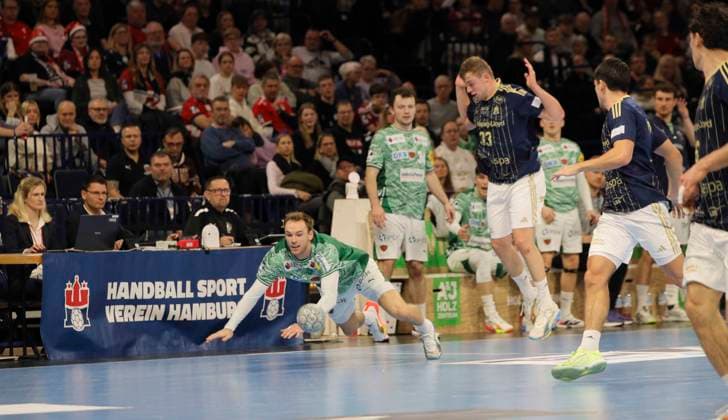 Photo Mathias Gidsel Füchse tackles Moritz SAUTER , right Handball Men 1 Bundesliga on Tue 23 12 2025 HSV Handball Füchse Berlin