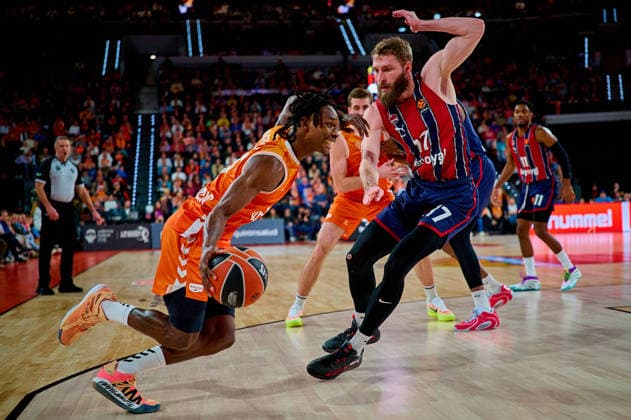 December 23, 2025, Valencia, Spain: Brancou Badio of Valencia Basket and Gytis Radzevicius of Kosner Baskonia Vitoria-Gasteiz seen in action during the EuroLeague Basketball regular season gameday 18, between Valencia Basket (ESP) and Kosner Baskonia Vitoria-Gasteiz (ESP) at Roig Arena. Final scores: Valencia Basket 91-81 Kosner Baskonia Valencia Spain - ZUMAs197 20251223_aaa_s197_130 Copyright: xDavidxPastorxAndresx