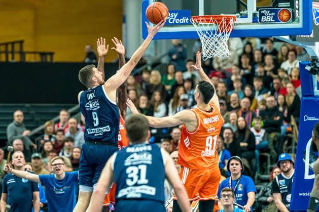 Leipzig, Germany 26 December 2025 1 BBL 2025 2026 Syntainics MBC vs Niners Chemnitz In the picture from left in the duel Kresimir Nikic MBC and Yordan Minchev 99 at the basket Copyright: xFotostandx xNachtigallx
