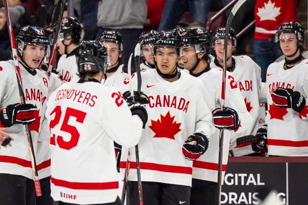 December 26, 2025, Minneapolis, Mn, Canada: Canada s Zayne Parekh (19), centre, celebrates his goal with teammates during second period IIHF World Junior Championship hockey action against Czechia, in Minneapolis, Friday, Dec. 26, 2025. Canada News - December 26, 2025 - ZUMAc35_ 20251226_zaf_c35_081 Copyright: xChristopherxKatsarovx