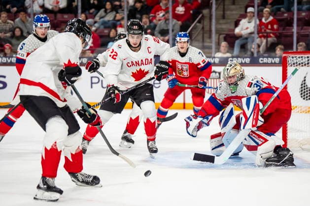 December 26, 2025, Minneapolis, Mn, Canada: Canada s Michael Misa (7) attacks Czechia goaltender Michal Orsulak (30) while Canada s Porter Martone (22) stands in front of the net during second period IIHF World Junior Championship hockey action, in Minneapolis, Friday, Dec. 26, 2025. Canada News - December 26, 2025  - ZUMAc35_ 20251226_zaf_c35_085 Copyright: xChristopherxKatsarovx