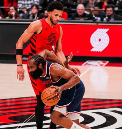 (251227) -- PORTLAND, Dec. 27, 2025 -- James Harden (front) of Los Angeles Clippers dribbles past Toumani Camara of Portland Trail Blazers during the 2025-2026 NBA, Basketball Herren, USA regular season match between Portland Trail Blazers and Los Angeles Clippers in Portland, the United States, Dec. 26, 2025. (Photo by Xinhua) (SP)U.S.-PORTLAND-BASKETBALL-NBA-CLIPPERS VS BLAZERS SunxYuxuan 