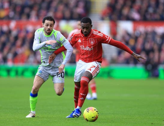 Nottingham, England, 27th December 2025. Bernardo Silva of Manchester City (l) tussles with Callum Hudson-Odoi of Nottingham Forest (r) during the Nottingham Forest vs Manchester City Premier League match at the City Ground, Nottingham. Picture credit should read: Jessica Hornby Sportimage EDITORIAL USE ONLY. No use with unauthorised audio, video, data, fixture lists, club league logos or live services. Online in-match use limited to 120 images, no video emulation. No use in betting, games or single club league player publications. SPI_031_JH_Forest_ManC SPI-4395-0031