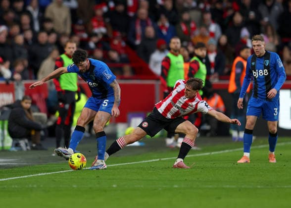 27th December 2025; Gtech Community Stadium, Brentford, London, England; Premier League Football, Brentford versus Bournemouth; Yehor Yarmoliuk of Brentford challenges Marcos Senesi of AFC Bournemouth  JohnxPatrickxFletcher