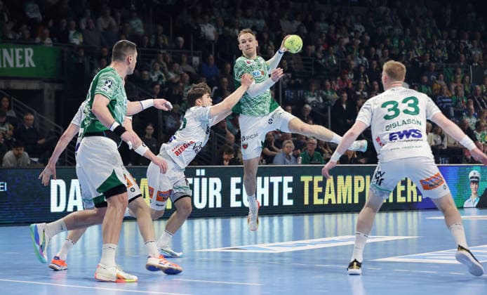 Elias Newel, Mathias Gidsel on the ball, Ymir Örn Gislason duel Game scene Action Sport Handball HBL Bundesliga Men 19 Matchday Season 2025 2026 27 12 2025 Füchse Berlin vs Frisch Auf Göppingen