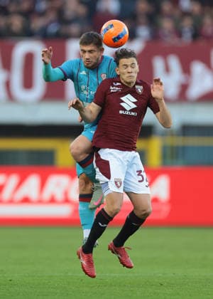 Turin, Italy, 27th December 2025. Semih Kilicsoy of Cagliari Calcio heads on from Kristjan Asllani of Torino FC during the Torino vs Cagliari Serie A match at Stadio Grande Torino, Turin. Picture credit should read: Jonathan Moscrop Sportimage EDITORIAL USE ONLY. No use with unauthorised audio, video, data, fixture lists, club league logos or live services. Online in-match use limited to 120 images, no video emulation. No use in betting, games or single club league player publications. SPI_131_JM_TORO_CAGLIARI SPI-4366-0130