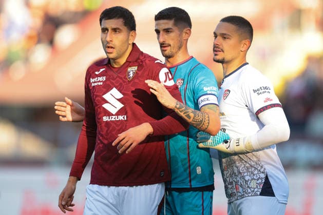 Turin, Italy, 27th December 2025. Guillermo Maripan of Torino FC is marked by Alessandro Deiola and Elia Caprile of Cagliari Calcio during the Torino vs Cagliari Serie A match at Stadio Grande Torino, Turin. Picture credit should read: Jonathan Moscrop Sportimage EDITORIAL USE ONLY. No use with unauthorised audio, video, data, fixture lists, club league logos or live services. Online in-match use limited to 120 images, no video emulation. No use in betting, games or single club league player publications. SPI_132_JM_TORO_CAGLIARI SPI-4366-0131