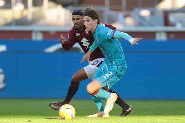 Turin, Italy, 27th December 2025. Marco Palestra of Cagliari Calcio is pursued by Valentino Lazaro of Torino FC during the Torino vs Cagliari Serie A match at Stadio Grande Torino, Turin. Picture credit should read: Jonathan Moscrop Sportimage EDITORIAL USE ONLY. No use with unauthorised audio, video, data, fixture lists, club league logos or live services. Online in-match use limited to 120 images, no video emulation. No use in betting, games or single club league player publications. SPI_133_JM_TORO_CAGLIARI SPI-4366-0132