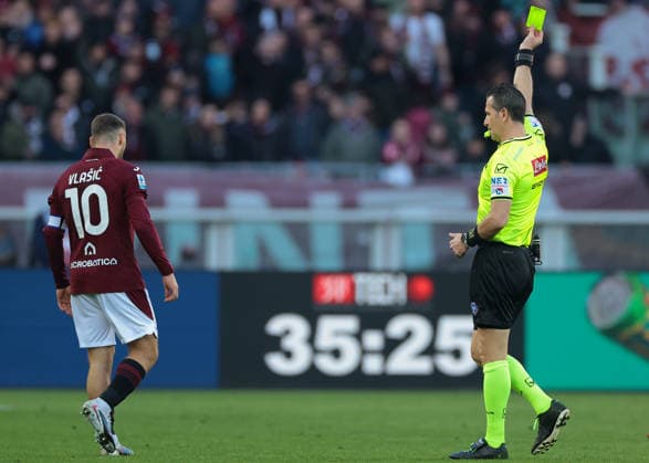 Turin, Italy, 27th December 2025. Nikola Vlasic of Torino FC is shown a yellow card by the Referee Daniele Doveri during the Torino vs Cagliari Serie A match at Stadio Grande Torino, Turin. Picture credit should read: Jonathan Moscrop Sportimage EDITORIAL USE ONLY. No use with unauthorised audio, video, data, fixture lists, club league logos or live services. Online in-match use limited to 120 images, no video emulation. No use in betting, games or single club league player publications. SPI_141_JM_TORO_CAGLIARI SPI-4366-0140