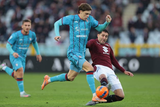 Turin, Italy, 27th December 2025. Guillermo Maripan of Torino FC challenges Marco Palestra of Cagliari Calcio during the Torino vs Cagliari Serie A match at Stadio Grande Torino, Turin. Picture credit should read: Jonathan Moscrop Sportimage EDITORIAL USE ONLY. No use with unauthorised audio, video, data, fixture lists, club league logos or live services. Online in-match use limited to 120 images, no video emulation. No use in betting, games or single club league player publications. SPI_145_JM_TORO_CAGLIARI SPI-4366-0144